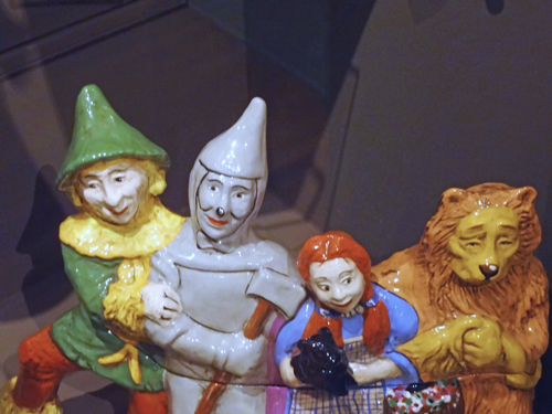 ceramic image of scarecrow, tin man, dorothy and cowardly lion