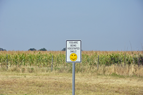 sign: You are being videotaped, smile