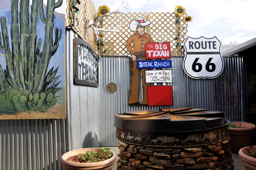 The back patio of the Big Texan Steak Ranch restaurant & a route 66 sign
