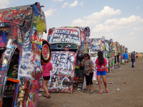Brightly-painted Cadillacs, all in a row at Cadillac Ranch in Texas