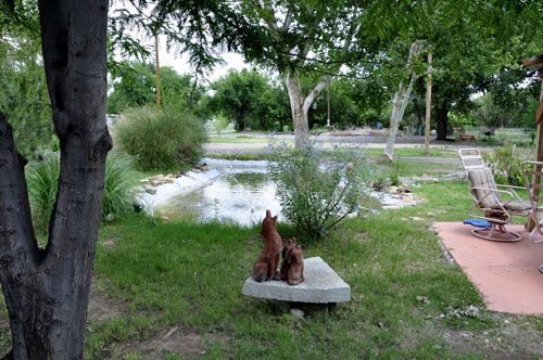 A nice little pond and dog statues in the two RV Gypsies yard in Tucumcari NM