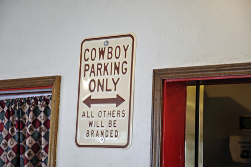 sign: Cowboy parking only