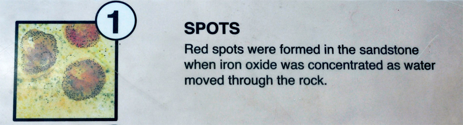 sign about red spots in the sandstone