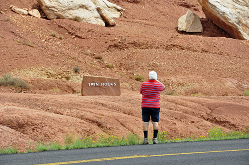 Lee Duquette stands by the road to photograph the Twin Rocks