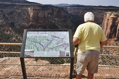 Lee Duquette reading the sign at Colorado National Monument