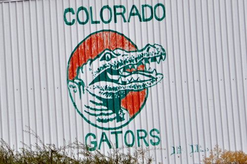sign painted on a building: Colorado Gators