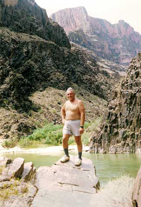 Lee Duquette on the rocks by the waterfall