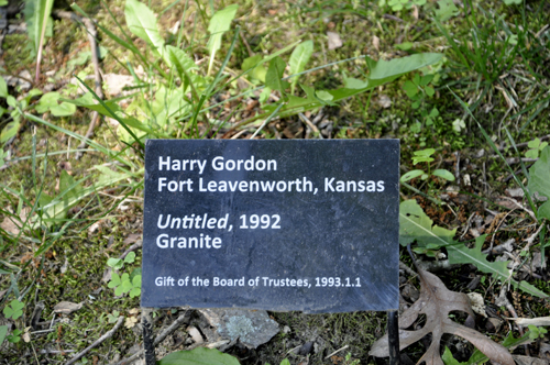 sign about the artist of the untitled granite sculpture