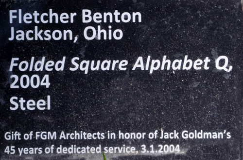 sign about the art sculpture Folded Square Alphabet Q