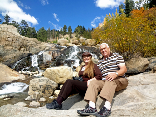 the two RV Gypsies and the waterfall At Rocky Mtn National Park