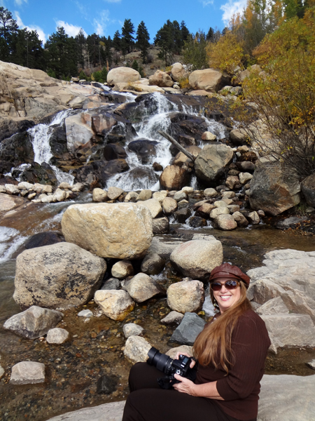 Karen Duquette and the waterfall at Rocky Mountain National Park