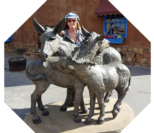 Karen Duquette and donkey statues in Santa Fe