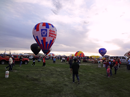 hot air balloons and many people