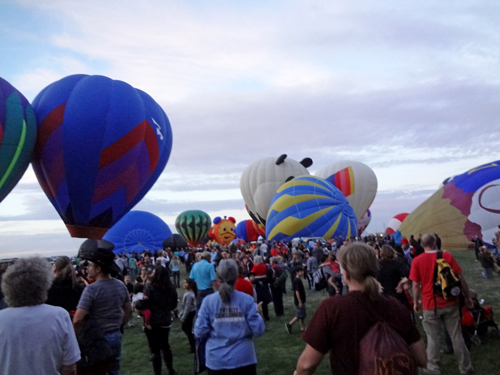 hot air balloons and many people