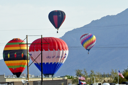 hot air balloons drift right over the campground