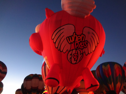 Ham-Let the flying pig hot air balloon glowing