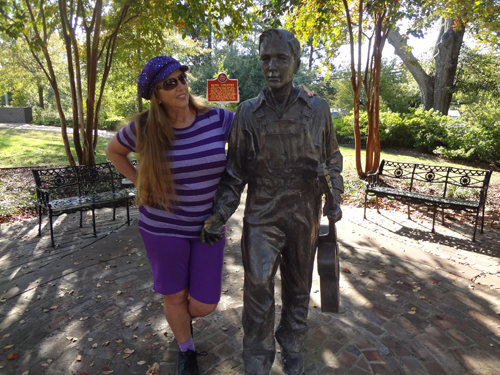 Karen Duquette with the Elvis at 13 statue