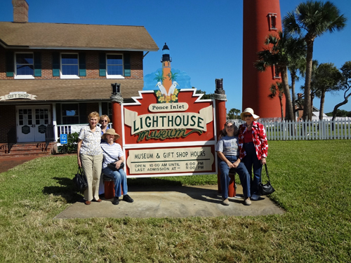 Karen's friends by the Ponce De Leon Lighthouse sign