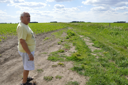 Lee Duquette in the cornfield ready to walk to the Buddy Holly plane crash site