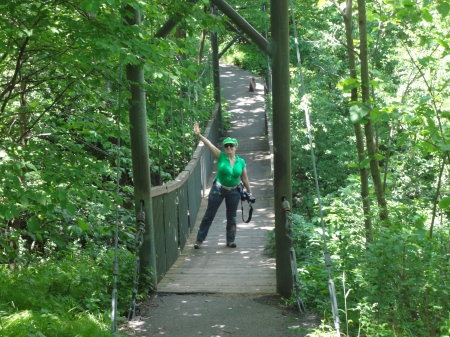 Karen Duquette on a suspension bridge leading to Ramsey Falls