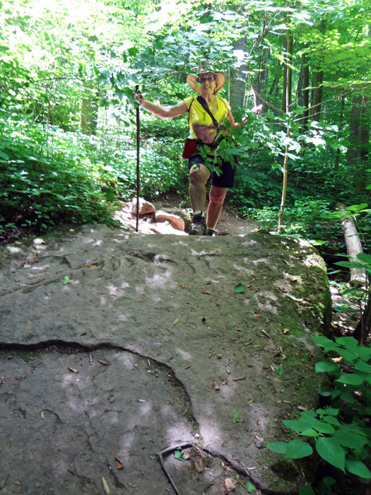 Karen Duquette on a big boulder on the path to Anglin Falls