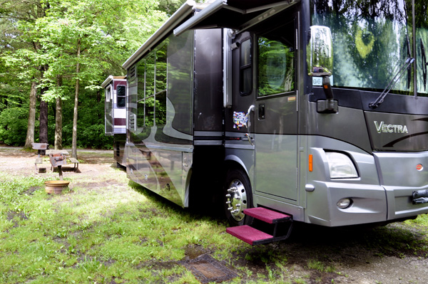 the RV of the two RV Gypsies on a wet campsite