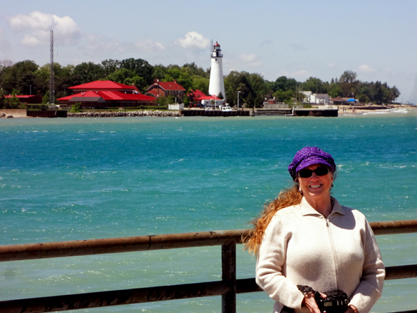 Karen Duquette with the lighthouse in the background