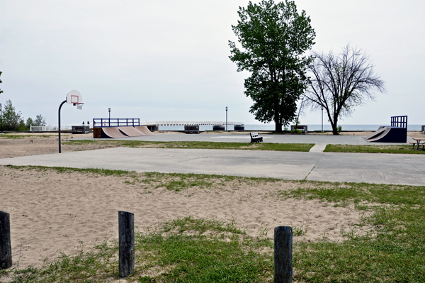 The basketball court and skateboard area.