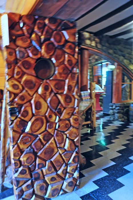 a carved door inside Legs Inn in Cross Village