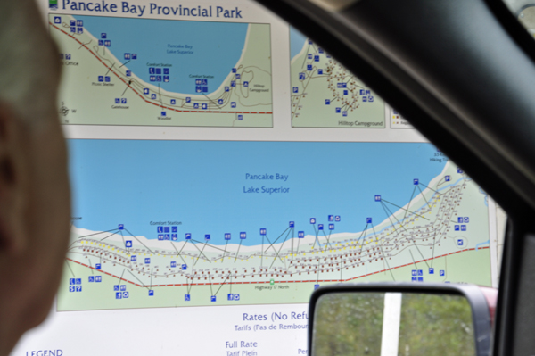 Lee Duquette entering Pancake Bay Provincial Park and studying the map