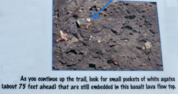 a sign about small pockets of white agates 
