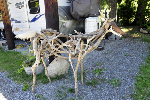 a deer sculpture made of wood