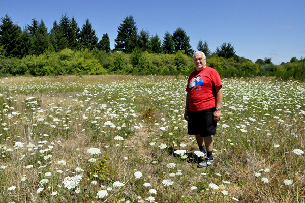 Lee Duquette in a big field of wild flowers
