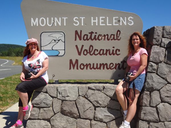 Karen Duquette and her sister Ilse at Mount St Helens sign