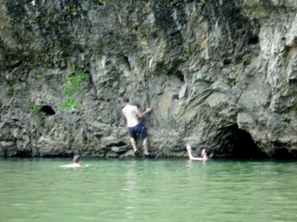 a boy jumping into the Meramac River
