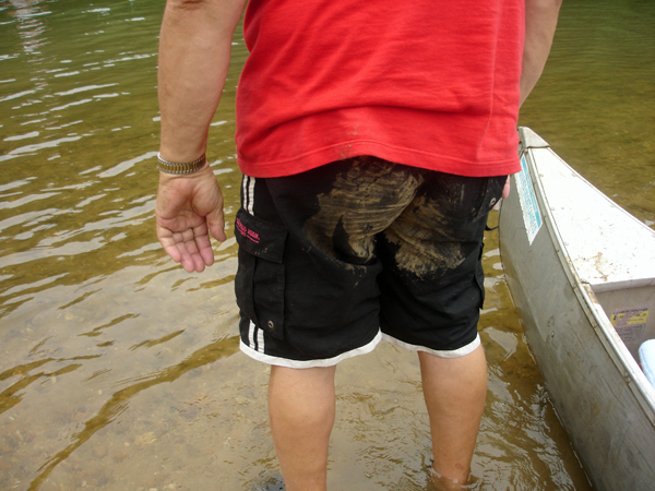 Lee with mud on his bathing suit