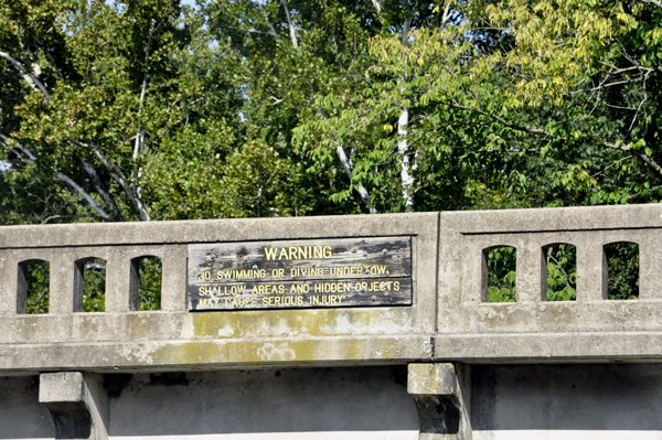 roadside bridge and warning sign