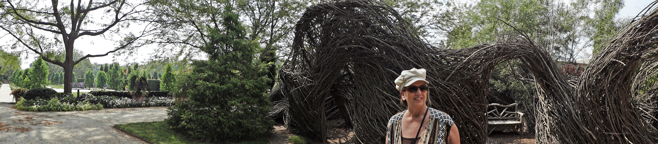 Karen Duquette outside of the twig maze