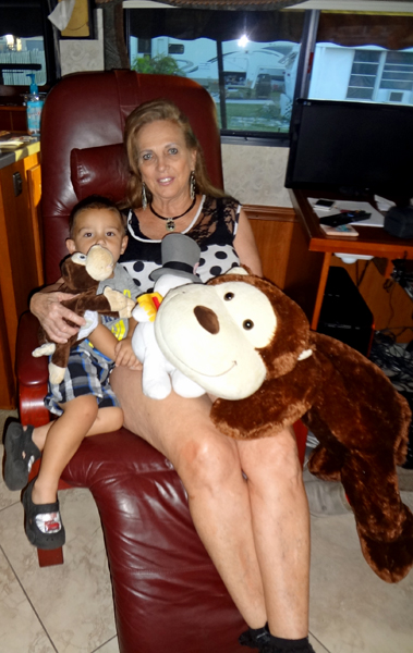 Karen Duquette and her great-grandson, plus cowboy the giant monkey, Chuckles the little monkey, and Frosty the snowman