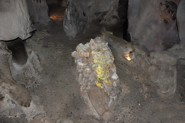 a lighted rock in the cave area