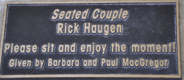 Plaque for the sculpture titled Seated Couple