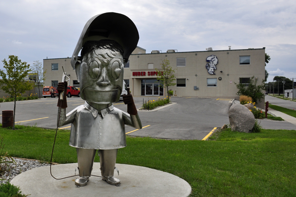 Huber Supply and logo statue