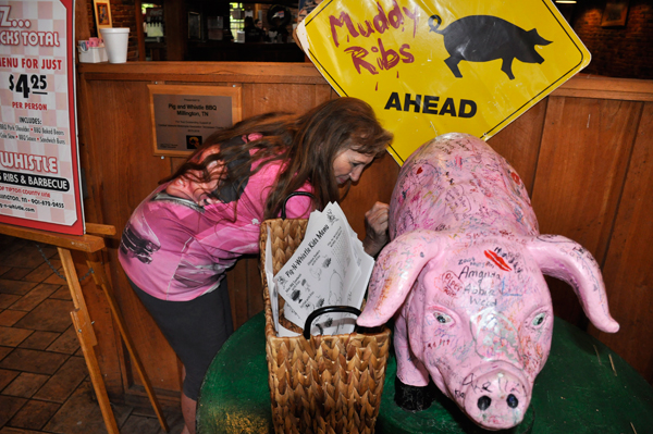 Karen Duquette autographed the pink pig 