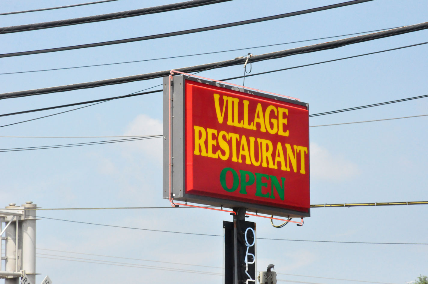 Sign for the Village Restaurant