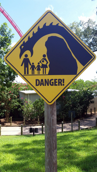sign about dinosaur danger