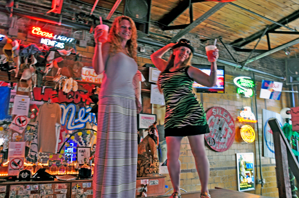 Ilse and Karen dance on the bar at Coyote Ugly