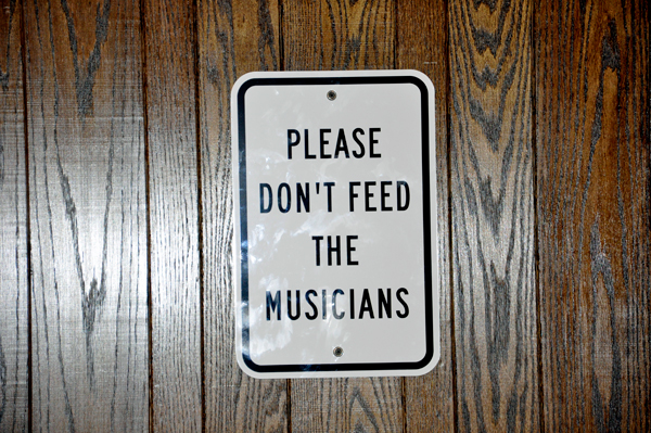 sign: Please don't feed the musicians