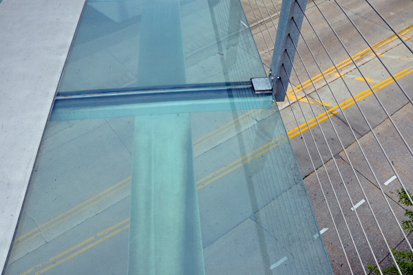 the glass bottom of the pedestrian bridge.