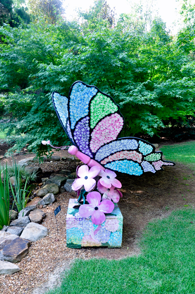 a giant butterfly and flowers in The Garden of Hope