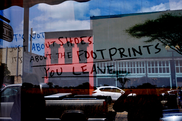 Footprints sign in a store window